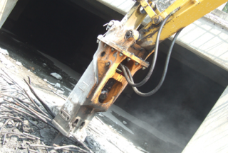 TECHNOLOGY Hydraulic Hammer vs. Steel Reinforced Concrete 